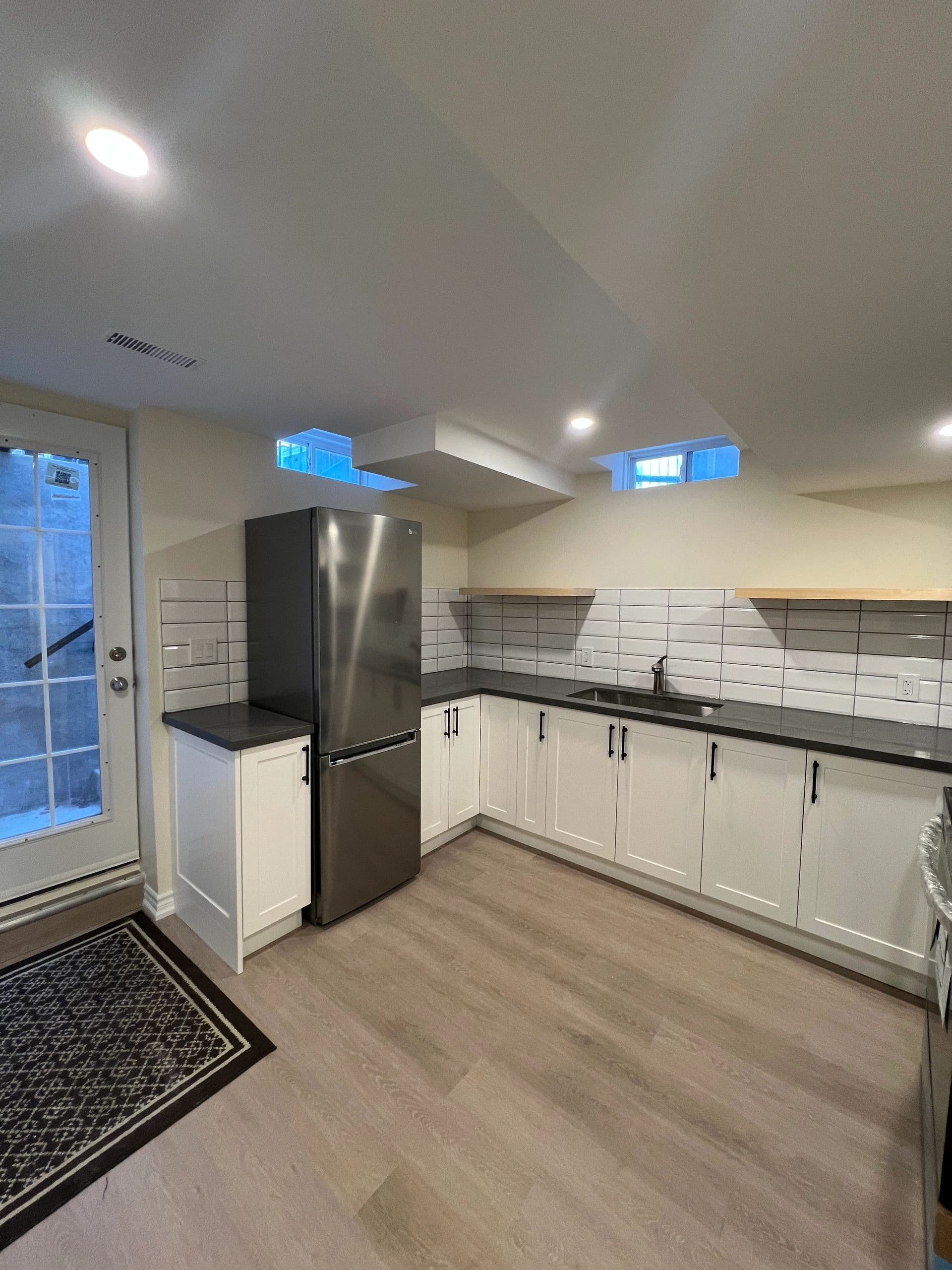 The Ali Residence — custom basement suite with kitchen and bathroom