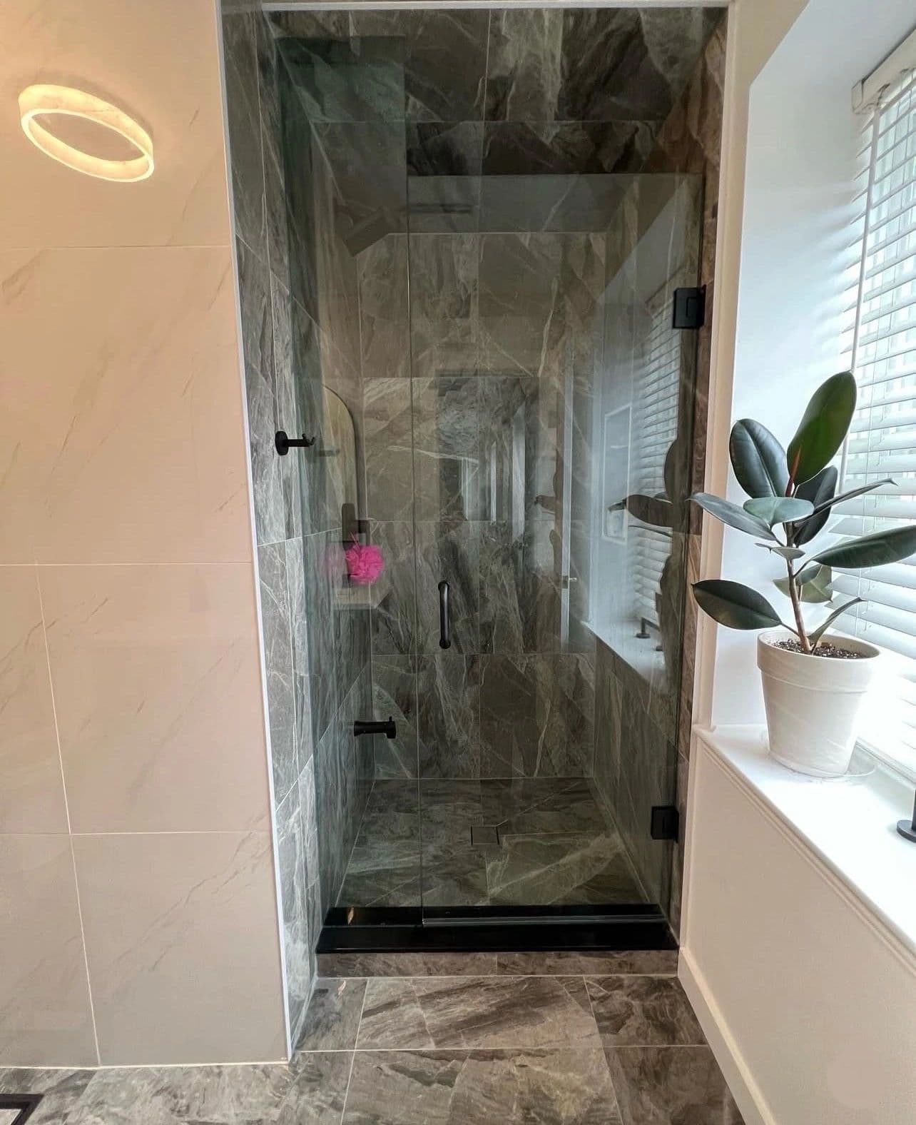 The Young Residence — wood vanity and marble tile bathroom renovation
